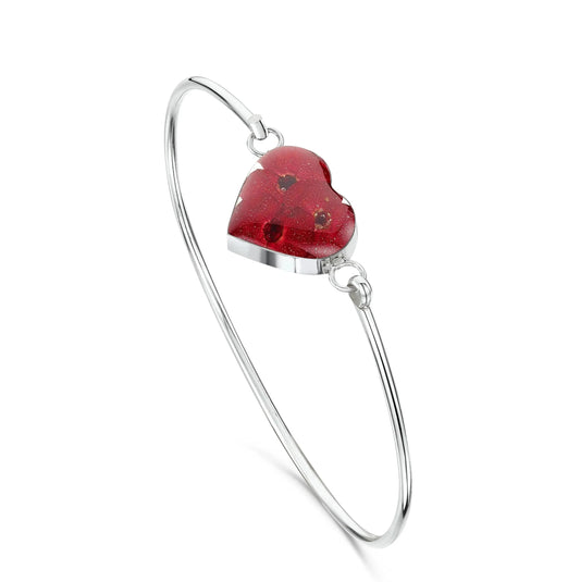 Poppy bangle with real flowers by  Shrieking Violet® Sterling silver heart bangle with tiny Euphorbia flowers. Includes giftbox.